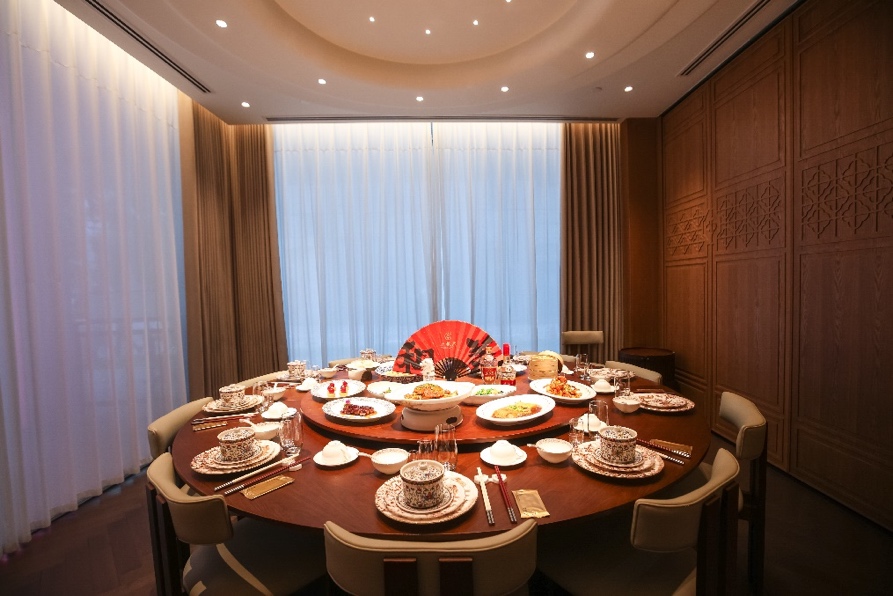 A table with plates and dishes on it
AI-generated content may be incorrect.